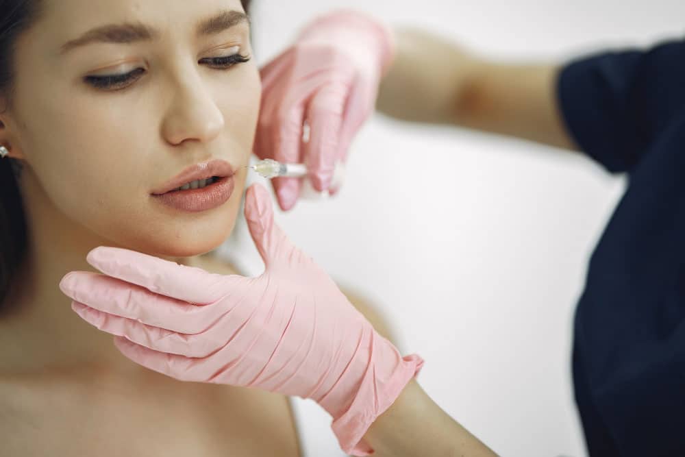 A Woman Getting Dermal Filler — Dentist in Palm Beach, QLD