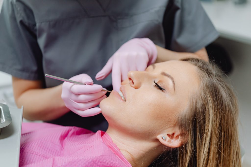 A Lady Getting a Root Canal Procedure — Dentist in Palm Beach, QLD
