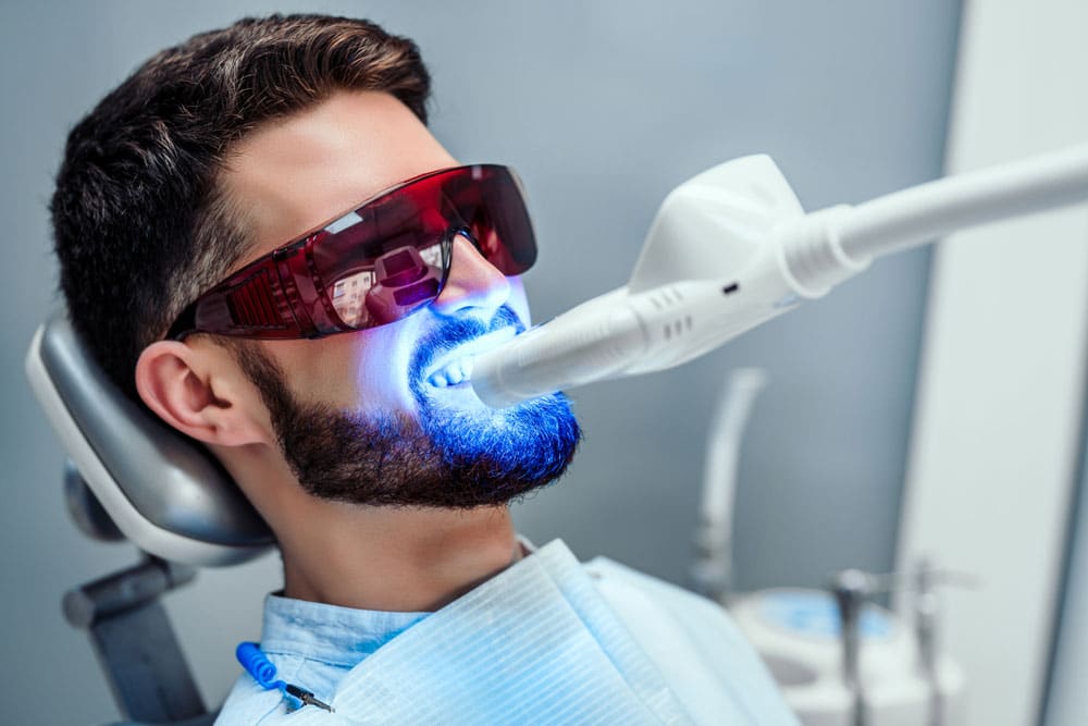 Man Undergoing Teeth Whitening Procedure