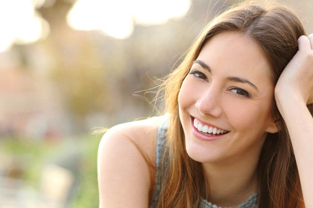 Woman With Perfect Smile And White Teeth