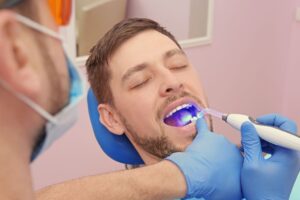 Dentist examining patient's teeth