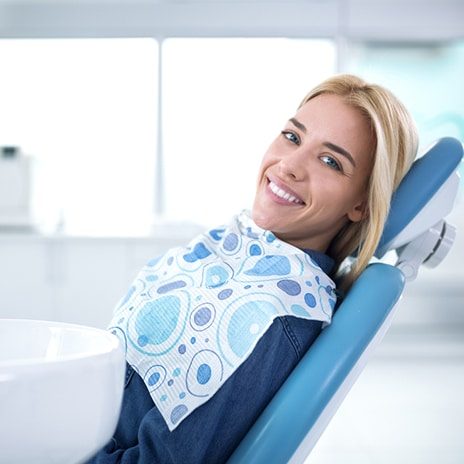 Smiling and Satisfied Patient in a Dental Office — Dentist in Palm Beach, QLD