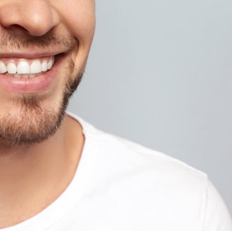 Young Man With Healthy White Teeth